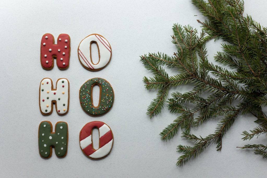 set of christmas gingerbread cookies arranged with spruce branch